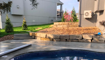 retaining wall installed in a pool area